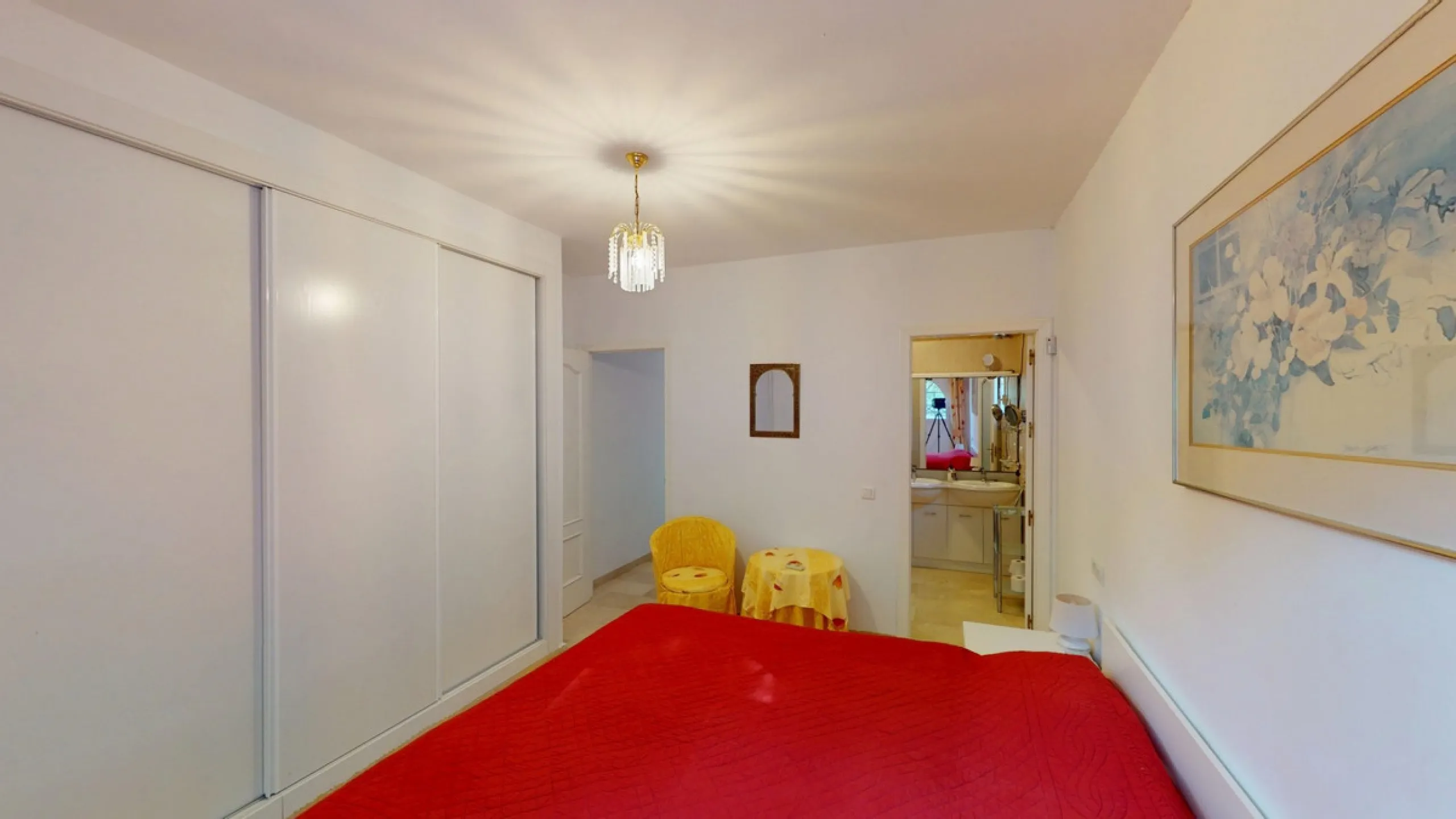 This elegant villa in Arenas, Málaga, offers a harmonious blend of space and style across two levels. The residence boasts four bedrooms and three bathrooms, with the primary bedroom providing generous personal space. The ground floor houses the main livi