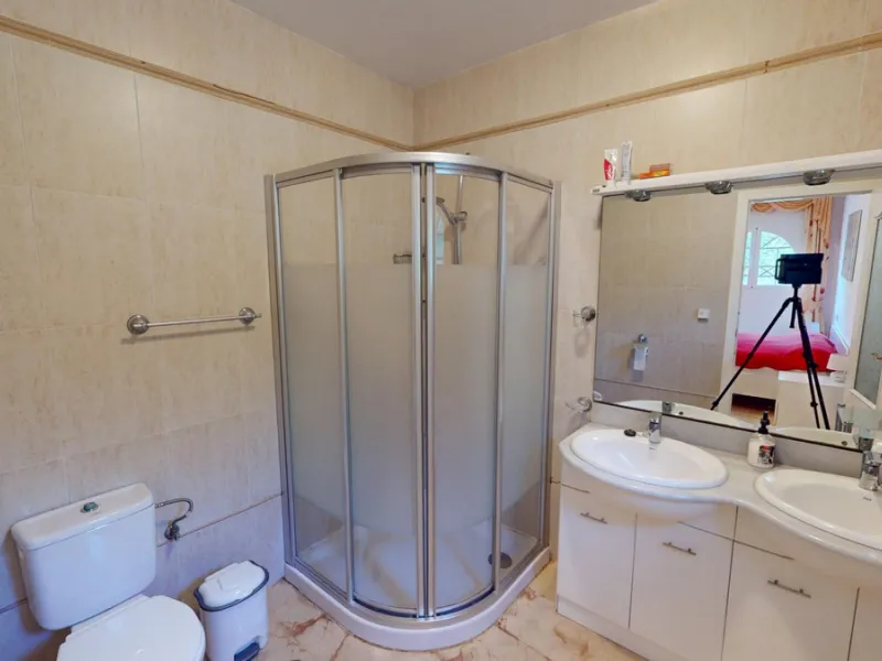 This elegant villa in Arenas, Málaga, offers a harmonious blend of space and style across two levels. The residence boasts four bedrooms and three bathrooms, with the primary bedroom providing generous personal space. The ground floor houses the main livi
