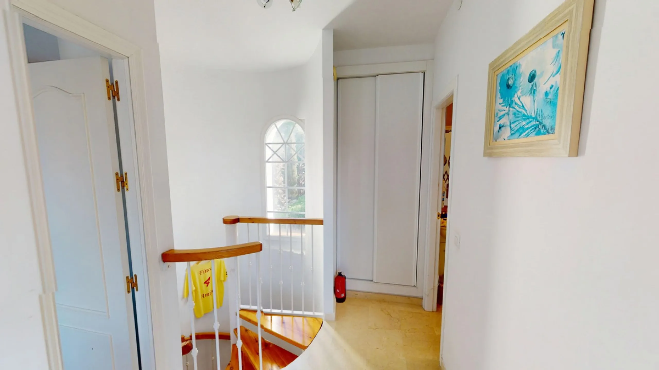 This elegant villa in Arenas, Málaga, offers a harmonious blend of space and style across two levels. The residence boasts four bedrooms and three bathrooms, with the primary bedroom providing generous personal space. The ground floor houses the main livi