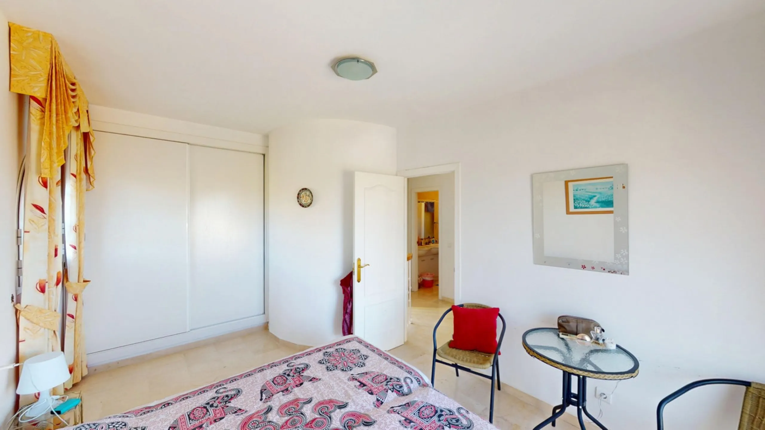 This elegant villa in Arenas, Málaga, offers a harmonious blend of space and style across two levels. The residence boasts four bedrooms and three bathrooms, with the primary bedroom providing generous personal space. The ground floor houses the main livi