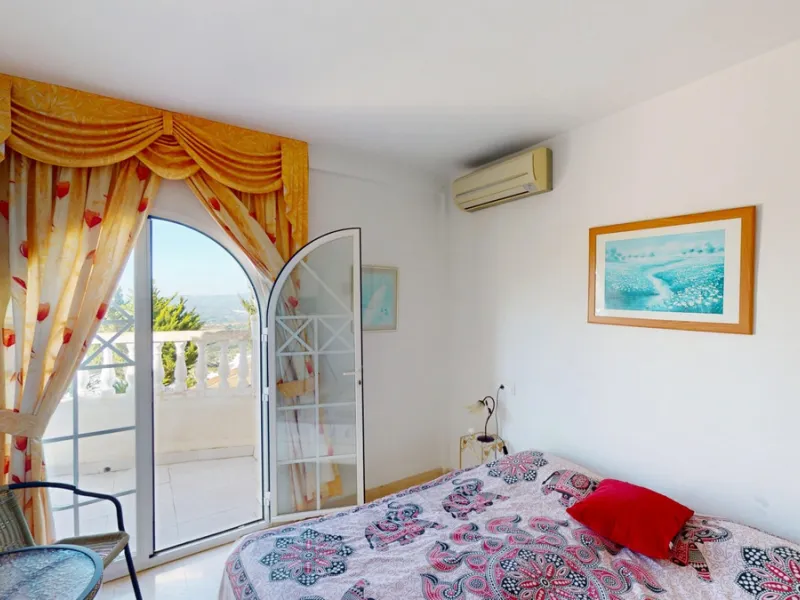 This elegant villa in Arenas, Málaga, offers a harmonious blend of space and style across two levels. The residence boasts four bedrooms and three bathrooms, with the primary bedroom providing generous personal space. The ground floor houses the main livi