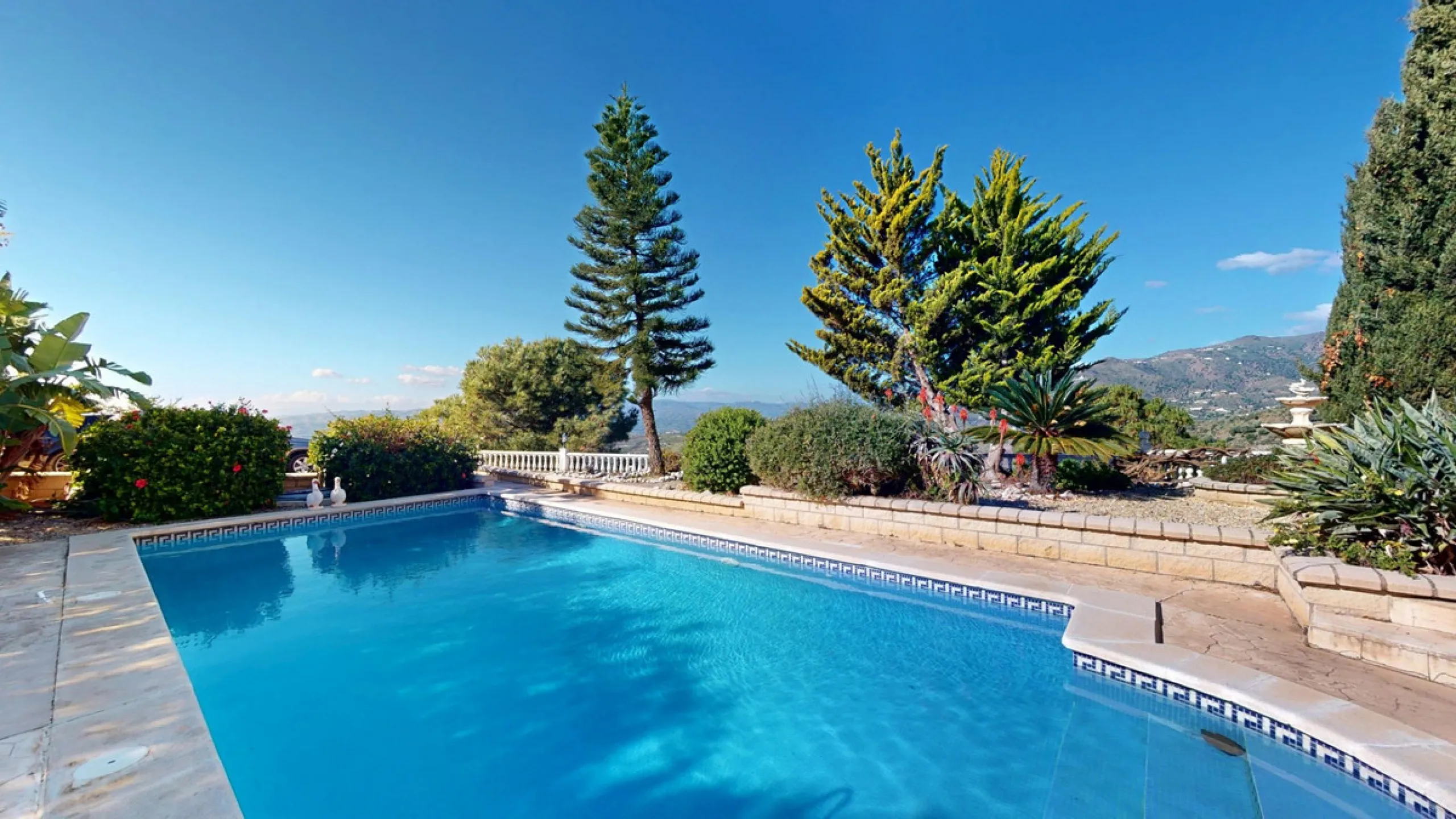 This elegant villa in Arenas, Málaga, offers a harmonious blend of space and style across two levels. The residence boasts four bedrooms and three bathrooms, with the primary bedroom providing generous personal space. The ground floor houses the main livi