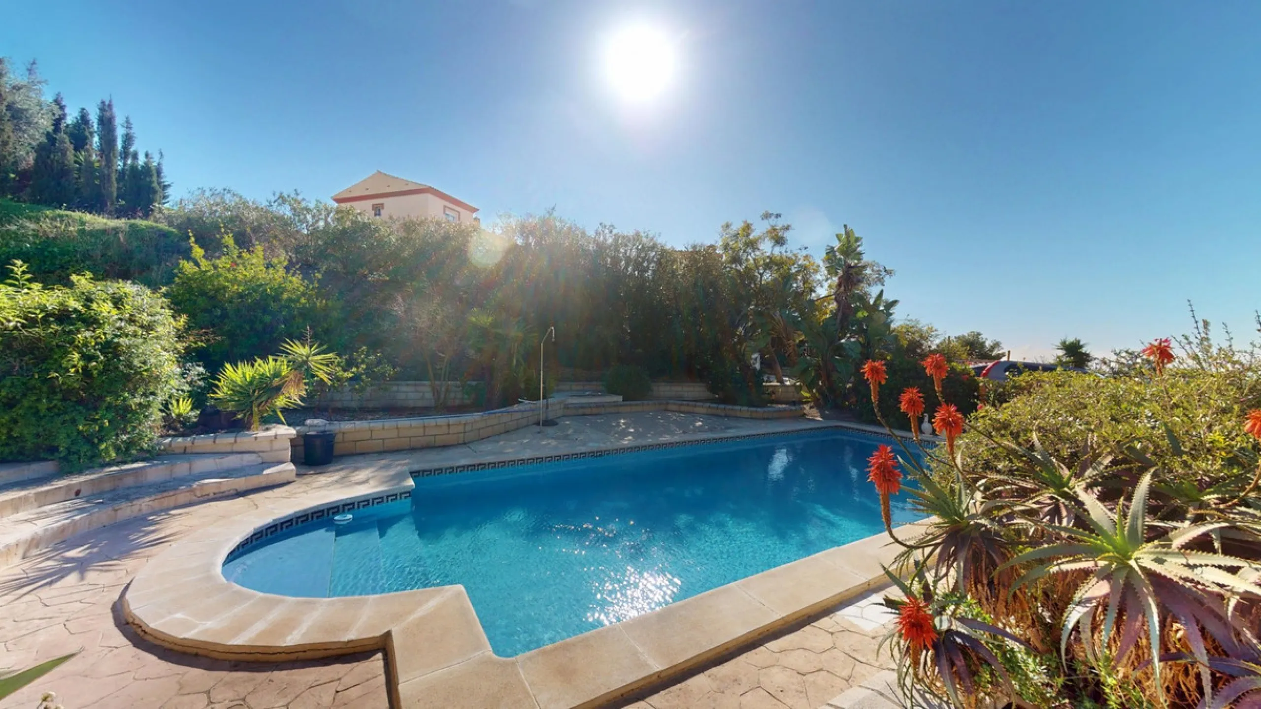 This elegant villa in Arenas, Málaga, offers a harmonious blend of space and style across two levels. The residence boasts four bedrooms and three bathrooms, with the primary bedroom providing generous personal space. The ground floor houses the main livi