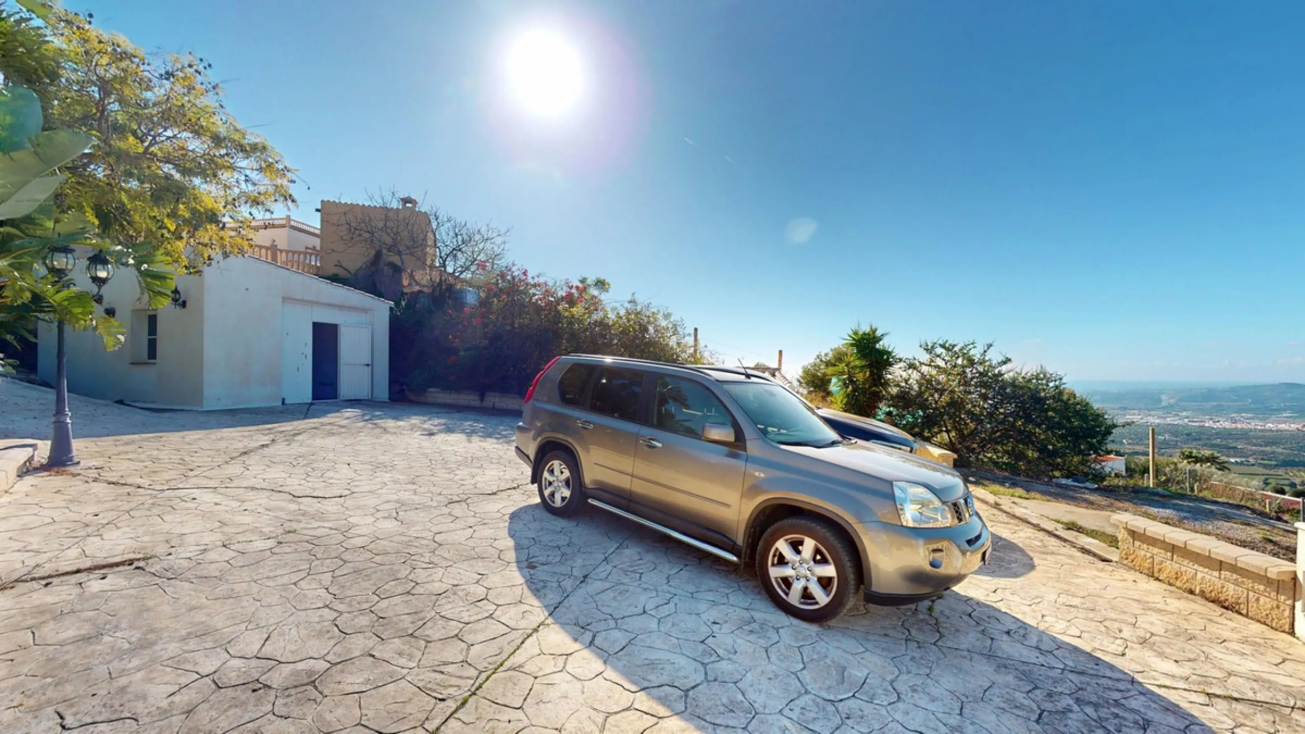 This elegant villa in Arenas, Málaga, offers a harmonious blend of space and style across two levels. The residence boasts four bedrooms and three bathrooms, with the primary bedroom providing generous personal space. The ground floor houses the main livi