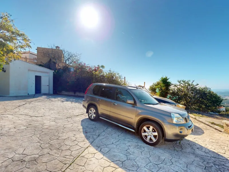 This elegant villa in Arenas, Málaga, offers a harmonious blend of space and style across two levels. The residence boasts four bedrooms and three bathrooms, with the primary bedroom providing generous personal space. The ground floor houses the main livi
