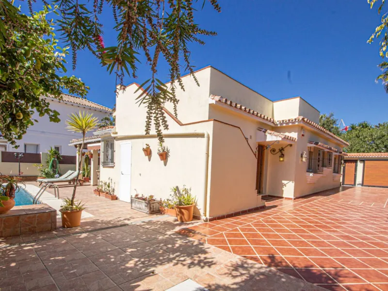 Charming Beachside Bungalow with Renovation Potential in Carib Playa