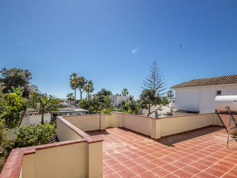 Charming Beachside Bungalow with Renovation Potential in Carib Playa