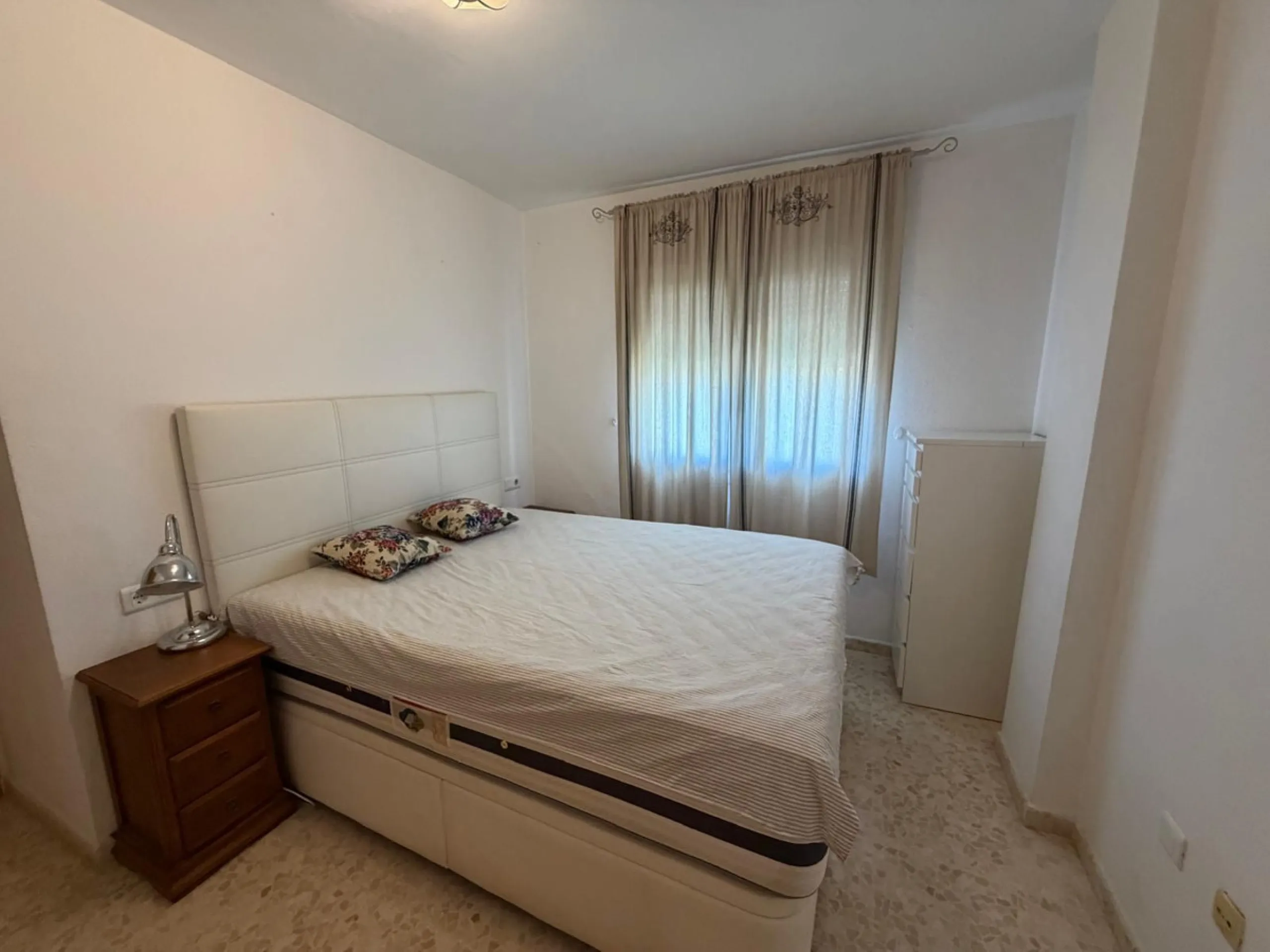 The property features 2 bedrooms and 2 bathrooms, making it ideal for both permanent living and holiday use. The apartment is in good condition and is sold fully furnished, with the exception of the terrace furniture.