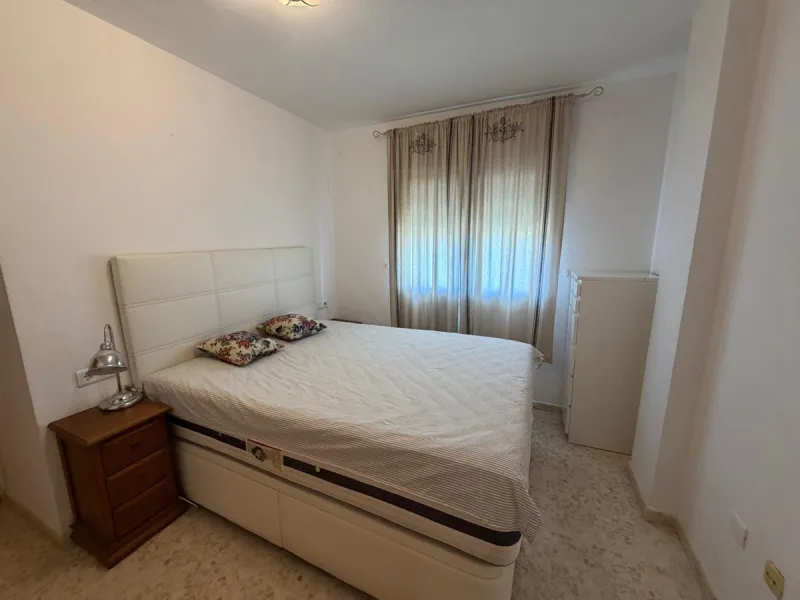 The property features 2 bedrooms and 2 bathrooms, making it ideal for both permanent living and holiday use. The apartment is in good condition and is sold fully furnished, with the exception of the terrace furniture.