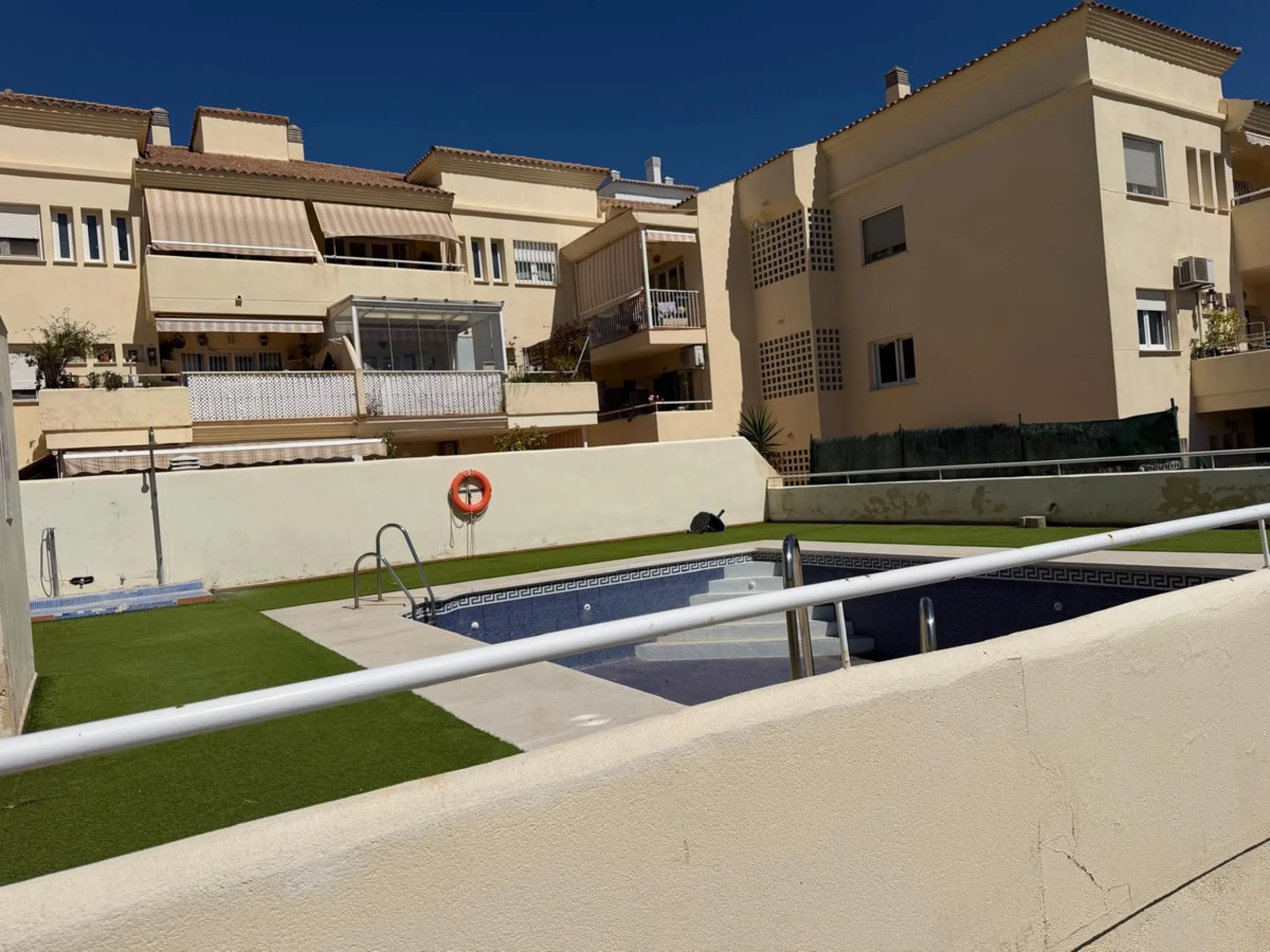 The property features 2 bedrooms and 2 bathrooms, making it ideal for both permanent living and holiday use. The apartment is in good condition and is sold fully furnished, with the exception of the terrace furniture.