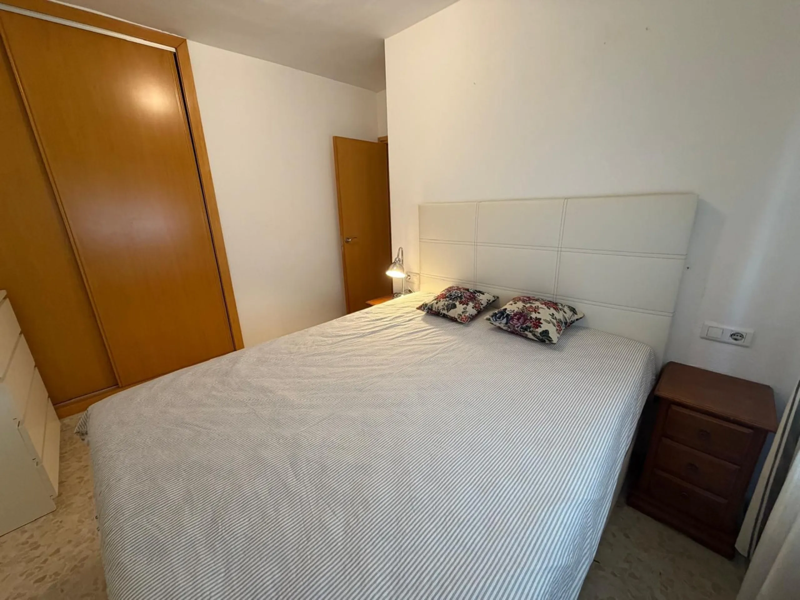 The property features 2 bedrooms and 2 bathrooms, making it ideal for both permanent living and holiday use. The apartment is in good condition and is sold fully furnished, with the exception of the terrace furniture.