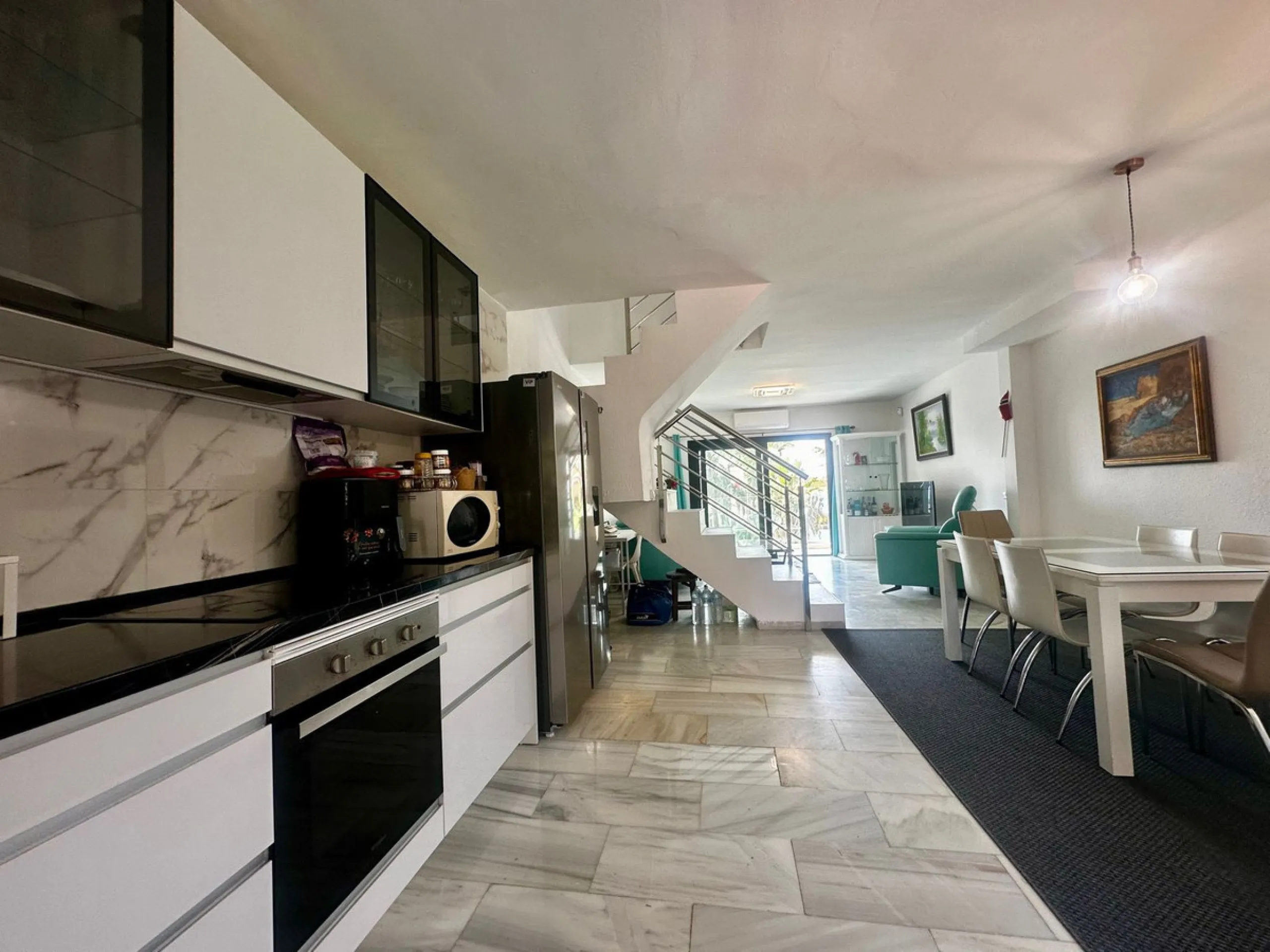 Charming semi-detached house in Calahonda, located on the first line of a golf course within a quiet residential area with a communal pool and beautifully maintained gardens.