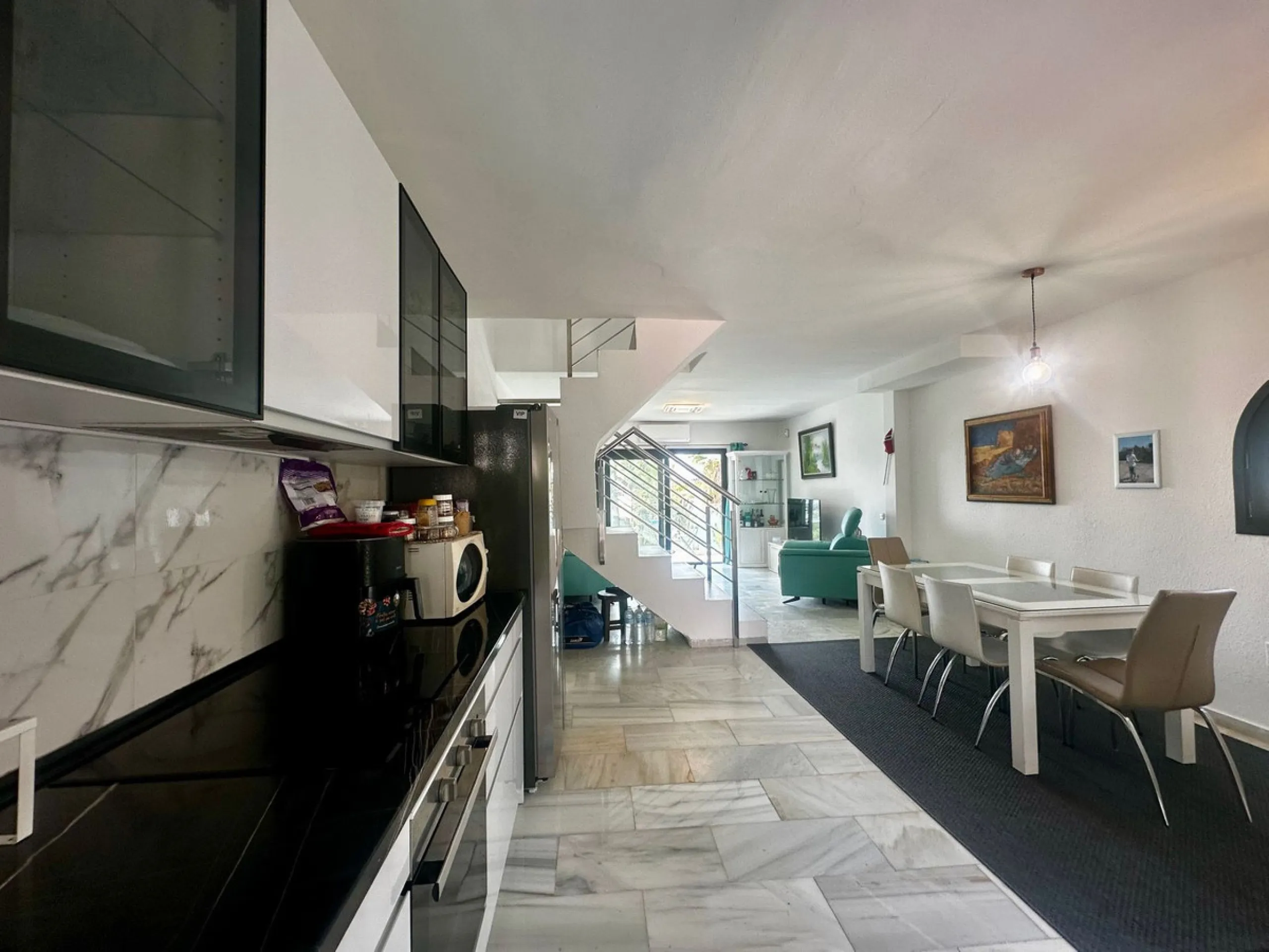 Charming semi-detached house in Calahonda, located on the first line of a golf course within a quiet residential area with a communal pool and beautifully maintained gardens.