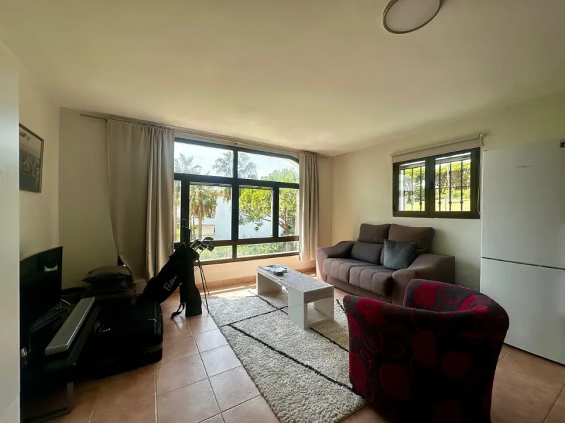 Charming semi-detached house in Calahonda, located on the first line of a golf course within a quiet residential area with a communal pool and beautifully maintained gardens.