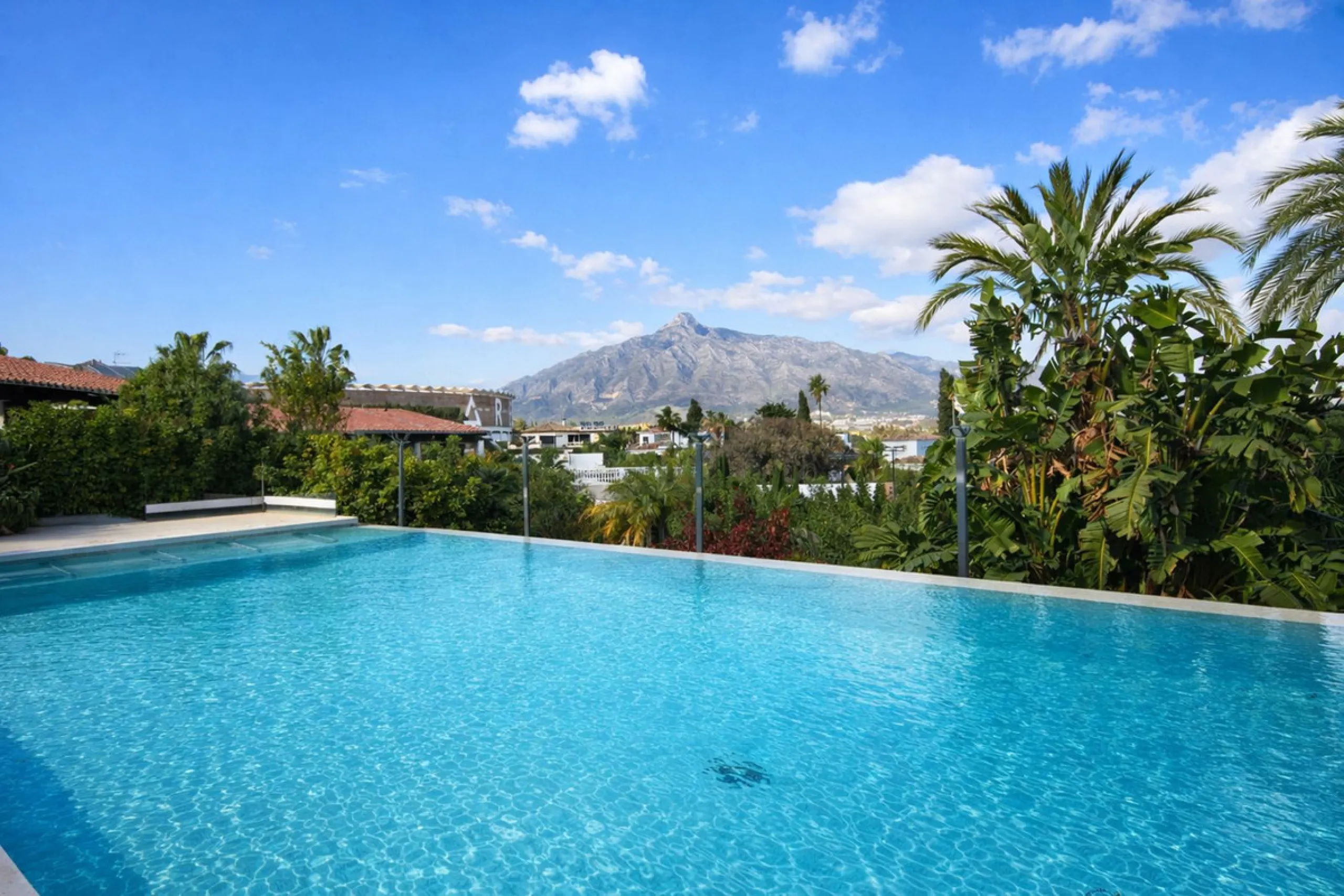 Elegant Marbella Estate on a Prime and Rare Plot — 800 meters Walking Distance to Puerto Banús. Unique Development Opportunity — 4,205m² Plot with Potential for Up to 4 Villas, or Plans for one large villa and separate Guest House, or to knock down and bu