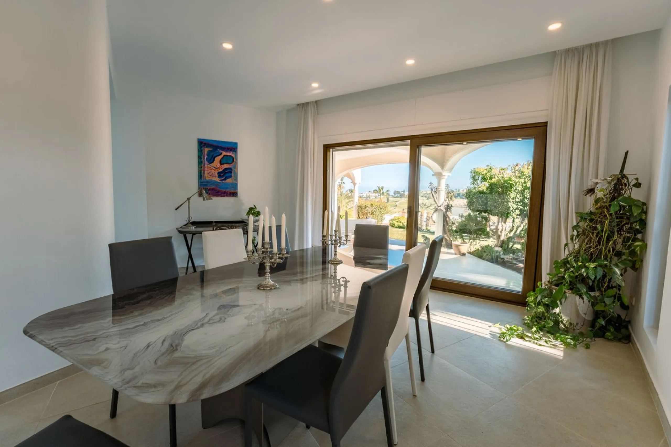 An exceptional south-facing villa, exquisitely modernised, occupying a privileged second-line golf position in El Paraíso, offering breathtaking 180-degree panoramic views across the golf course to the Mediterranean Sea and the North African coastline.