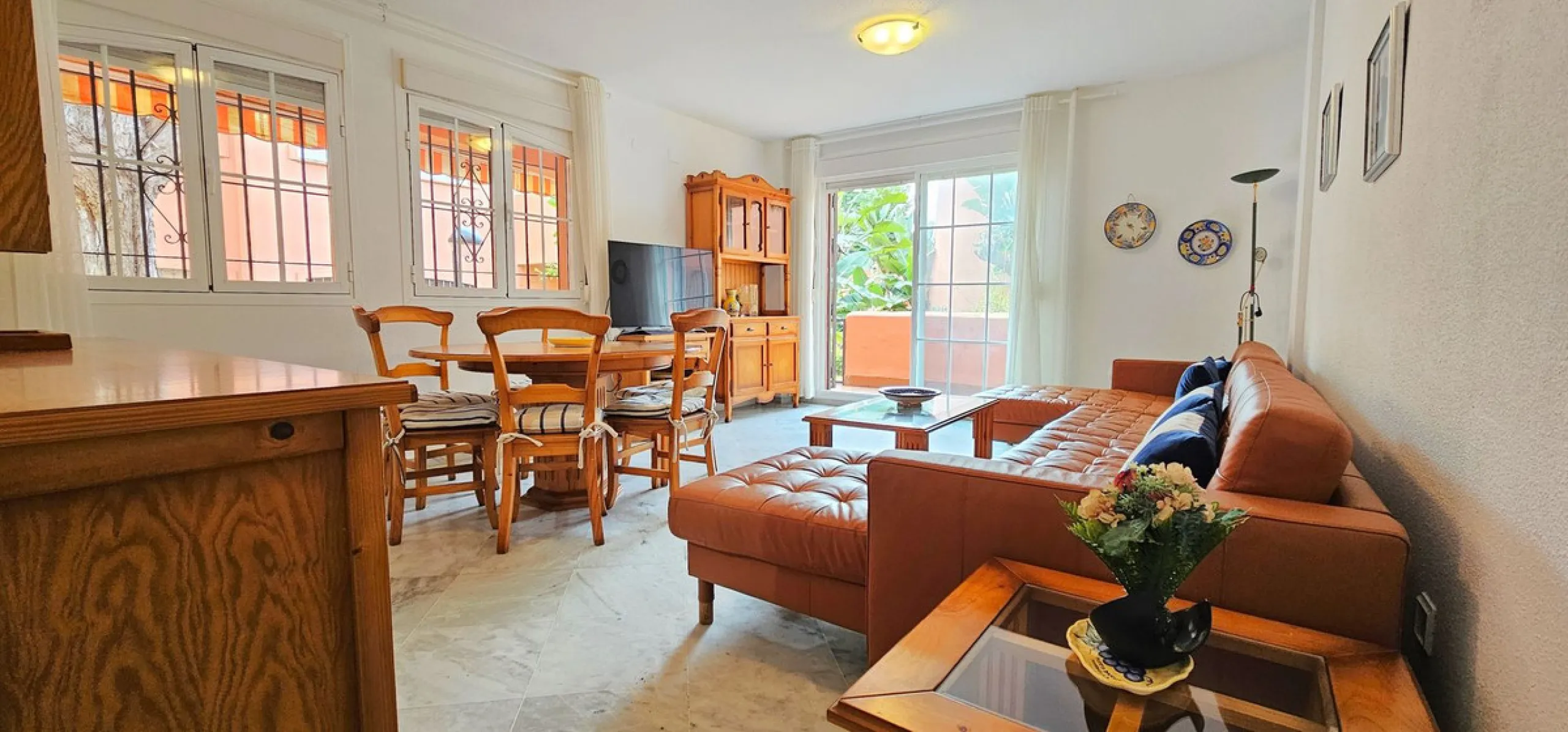 Fantastic, spacious and bright seaside elevated ground floor corner apartment, in a beachfront residential complex, located on one of the best beaches in Marbella. It features a large, very pleasant terrace that surrounds the entire property, perfect for 