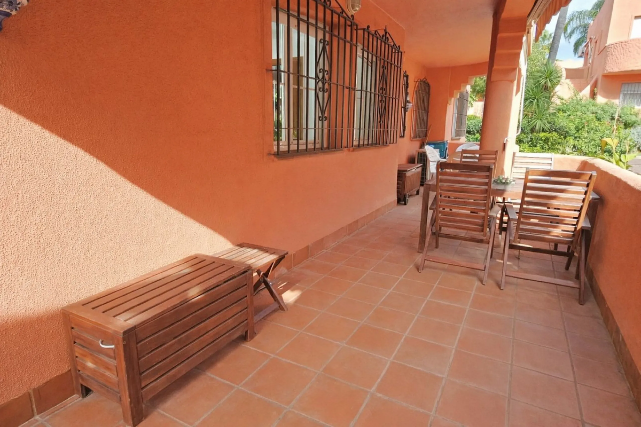 Fantastic, spacious and bright seaside elevated ground floor corner apartment, in a beachfront residential complex, located on one of the best beaches in Marbella. It features a large, very pleasant terrace that surrounds the entire property, perfect for 