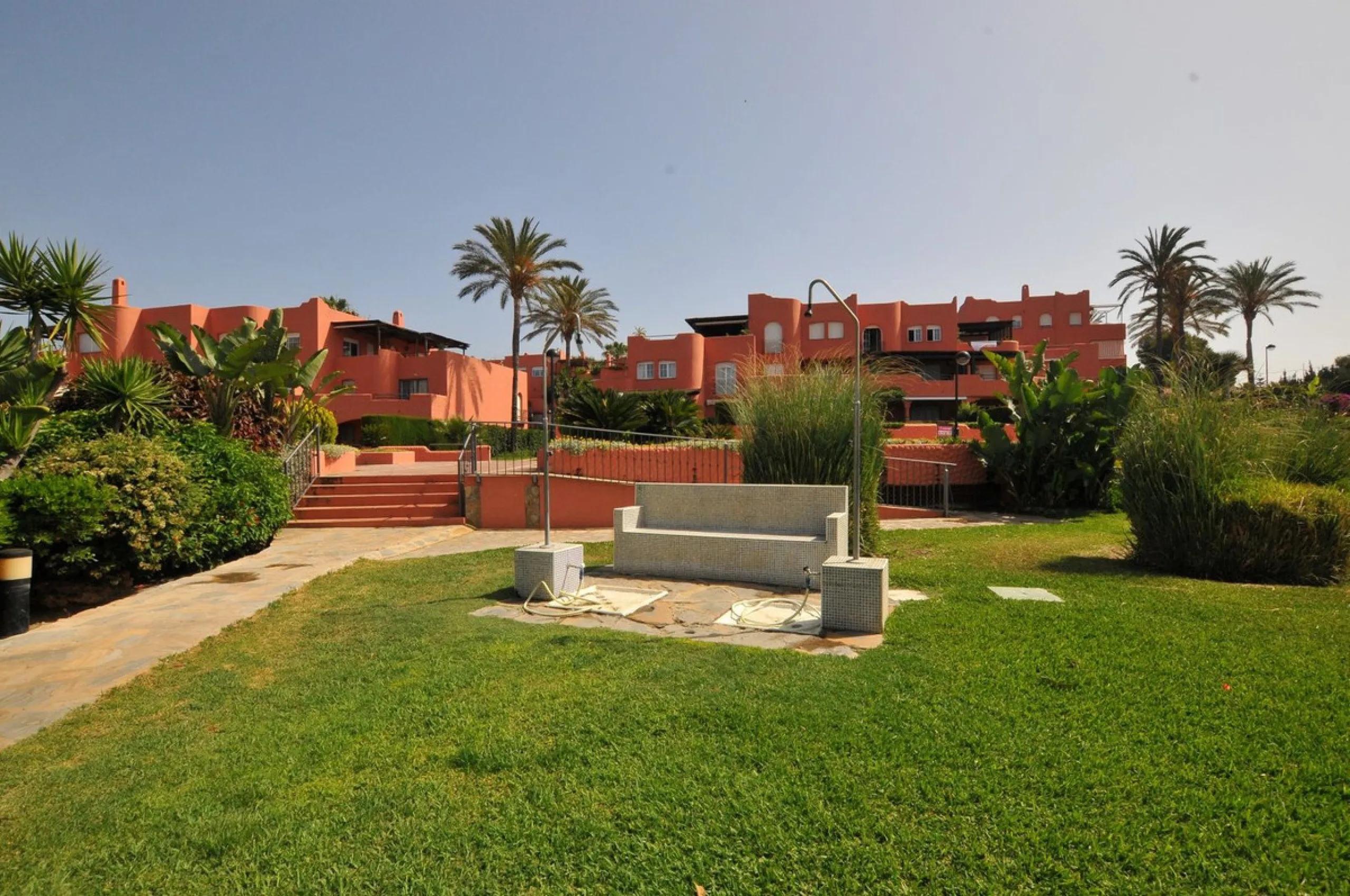 Fantastic, spacious and bright seaside elevated ground floor corner apartment, in a beachfront residential complex, located on one of the best beaches in Marbella. It features a large, very pleasant terrace that surrounds the entire property, perfect for 