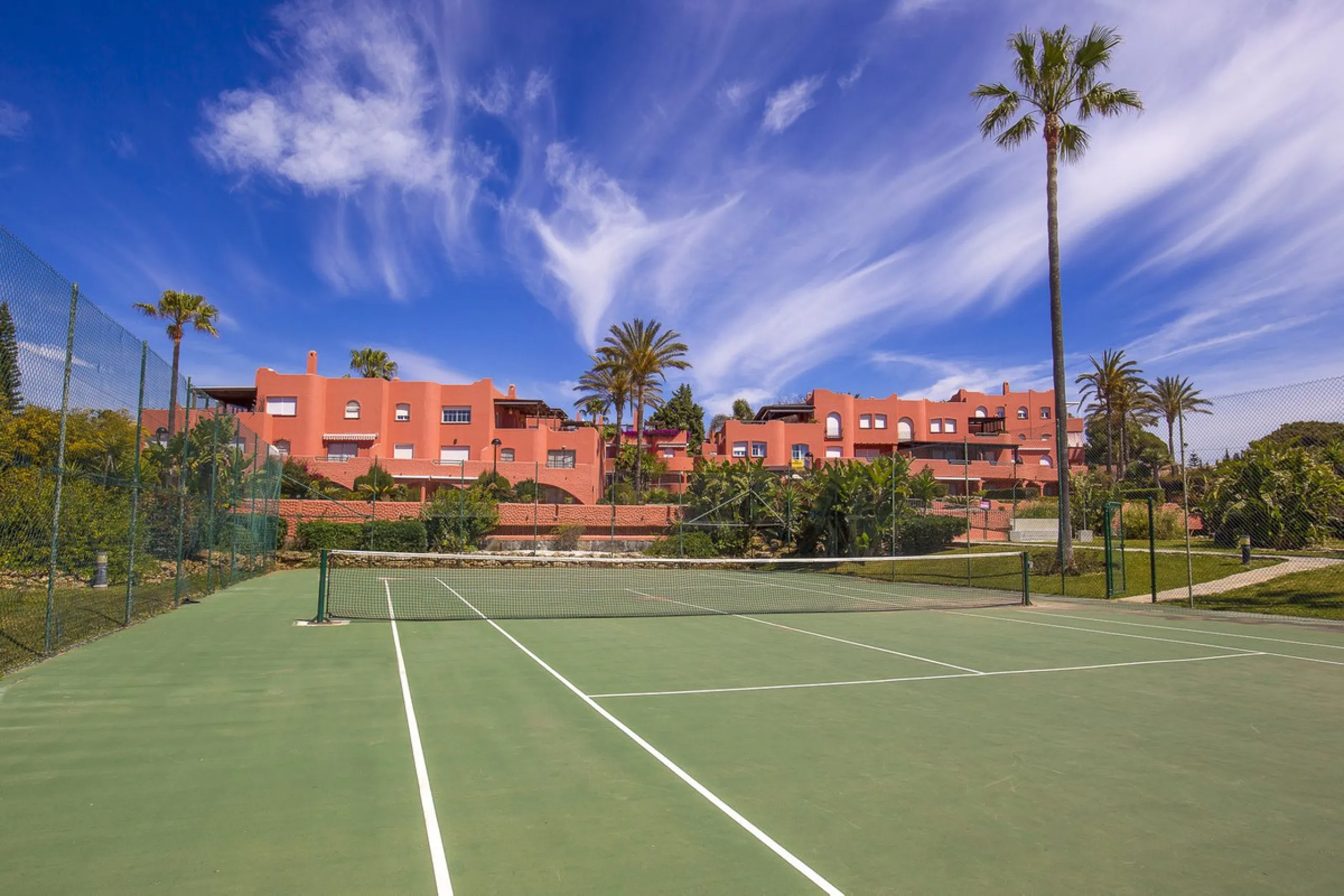 Fantastic, spacious and bright seaside elevated ground floor corner apartment, in a beachfront residential complex, located on one of the best beaches in Marbella. It features a large, very pleasant terrace that surrounds the entire property, perfect for 