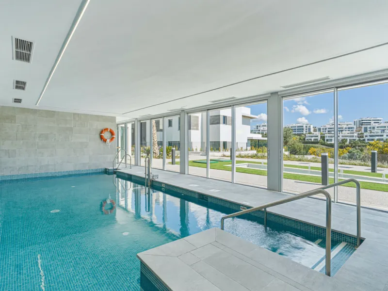 This magnificent ground-floor duplex apartment is located in Santa Clara, Marbella East, perfectly positioned close to the hospital, shops, golf courses, schools, and the beach. The property seamlessly blends indoor and outdoor living, featuring a private