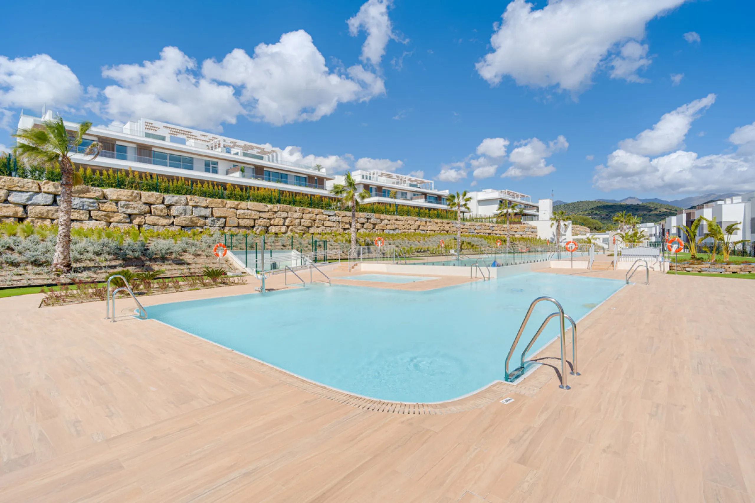 This magnificent ground-floor duplex apartment is located in Santa Clara, Marbella East, perfectly positioned close to the hospital, shops, golf courses, schools, and the beach. The property seamlessly blends indoor and outdoor living, featuring a private