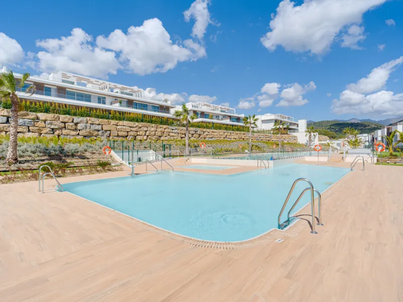 This magnificent ground-floor duplex apartment is located in Santa Clara, Marbella East, perfectly positioned close to the hospital, shops, golf courses, schools, and the beach. The property seamlessly blends indoor and outdoor living, featuring a private
