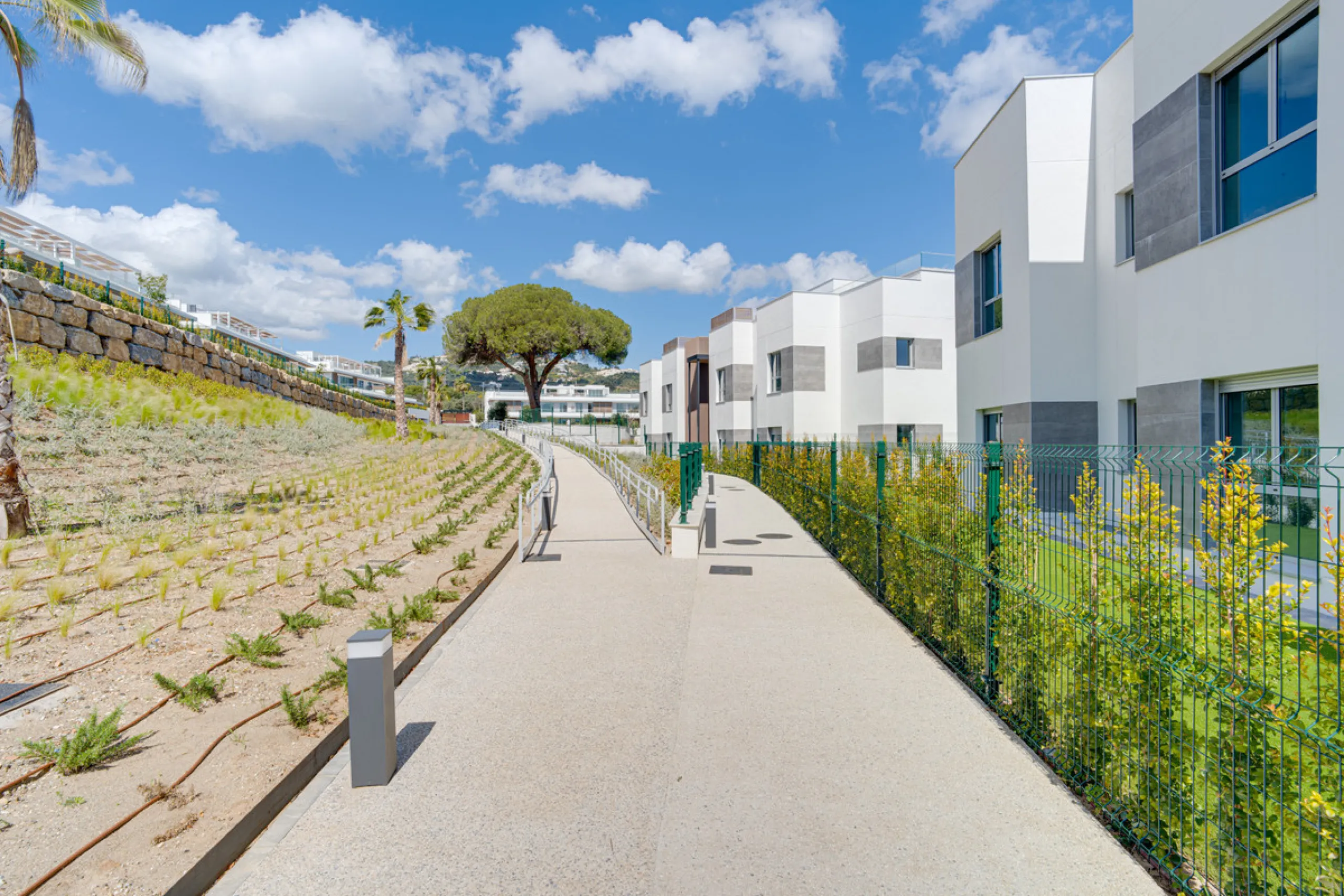 This magnificent ground-floor duplex apartment is located in Santa Clara, Marbella East, perfectly positioned close to the hospital, shops, golf courses, schools, and the beach. The property seamlessly blends indoor and outdoor living, featuring a private