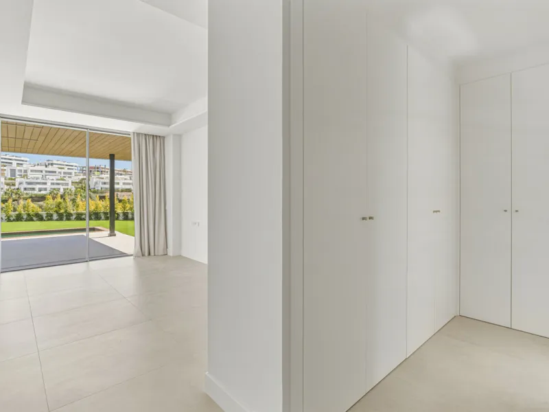 This magnificent ground-floor duplex apartment is located in Santa Clara, Marbella East, perfectly positioned close to the hospital, shops, golf courses, schools, and the beach. The property seamlessly blends indoor and outdoor living, featuring a private