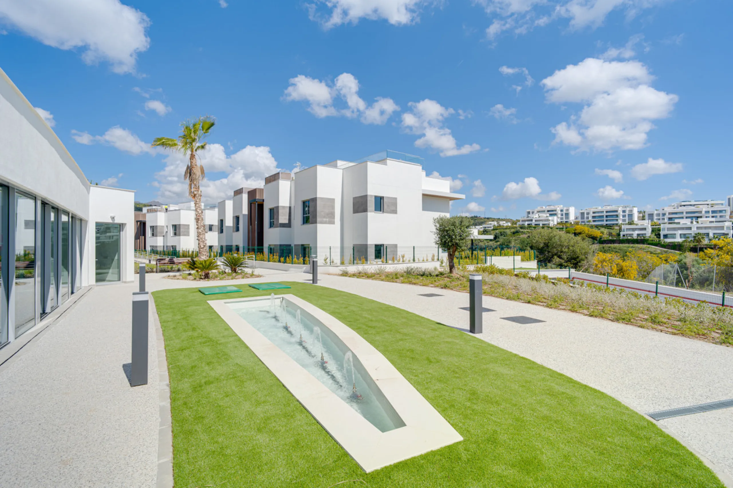 This magnificent ground-floor duplex apartment is located in Santa Clara, Marbella East, perfectly positioned close to the hospital, shops, golf courses, schools, and the beach. The property seamlessly blends indoor and outdoor living, featuring a private