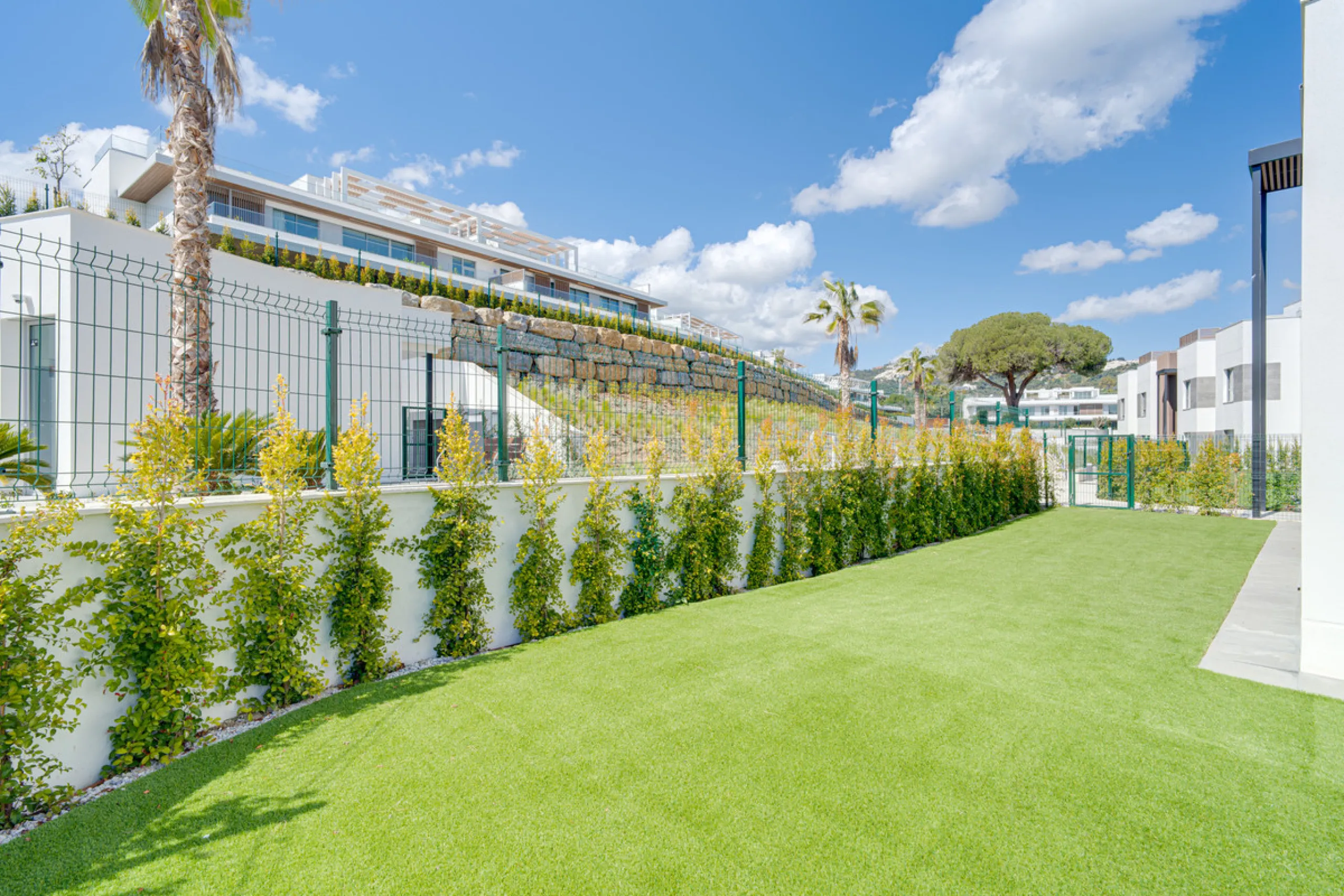 This magnificent ground-floor duplex apartment is located in Santa Clara, Marbella East, perfectly positioned close to the hospital, shops, golf courses, schools, and the beach. The property seamlessly blends indoor and outdoor living, featuring a private