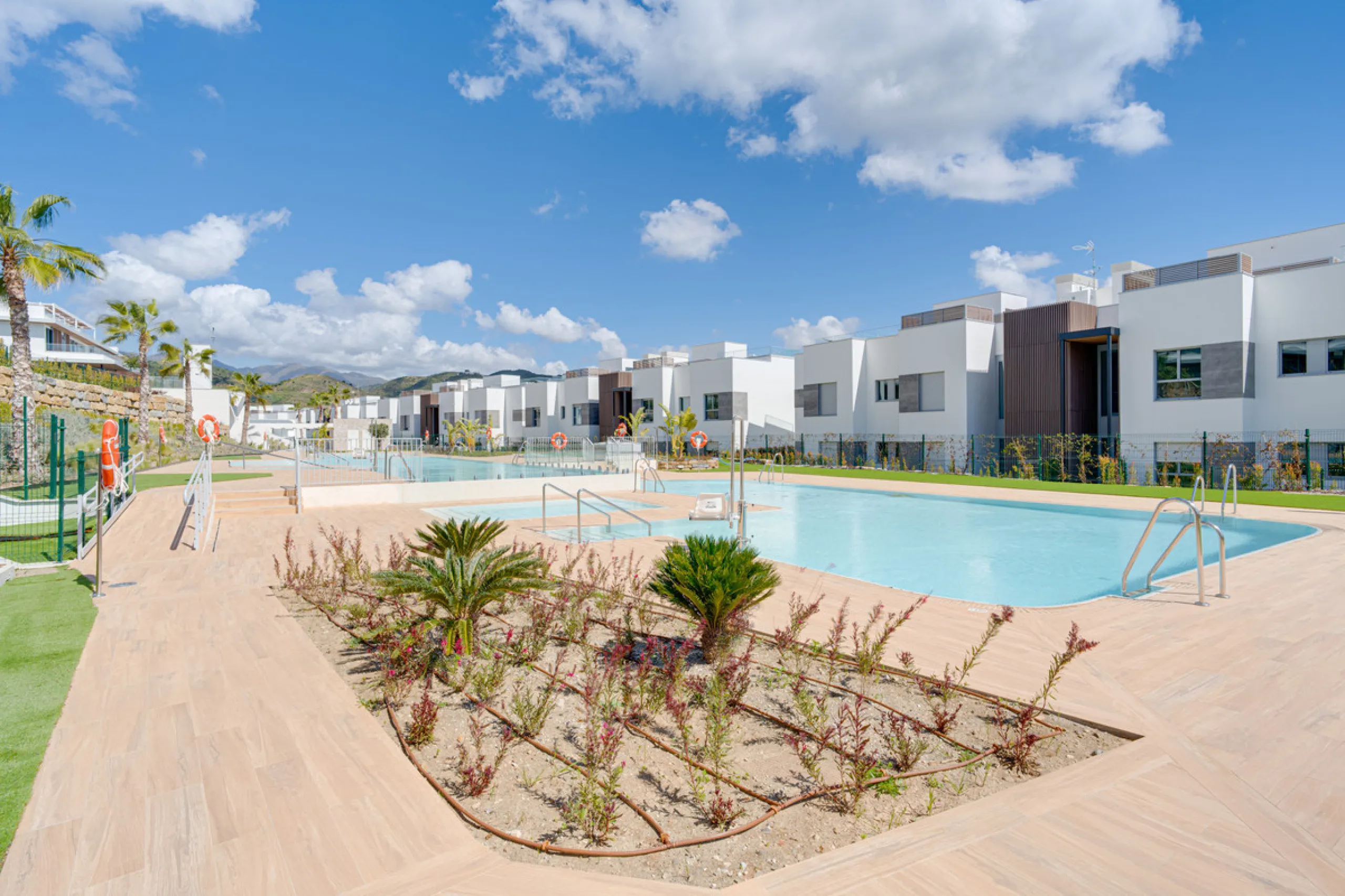 This magnificent ground-floor duplex apartment is located in Santa Clara, Marbella East, perfectly positioned close to the hospital, shops, golf courses, schools, and the beach. The property seamlessly blends indoor and outdoor living, featuring a private