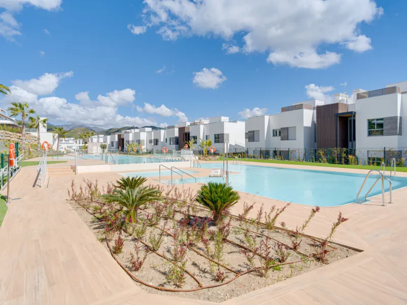This magnificent ground-floor duplex apartment is located in Santa Clara, Marbella East, perfectly positioned close to the hospital, shops, golf courses, schools, and the beach. The property seamlessly blends indoor and outdoor living, featuring a private