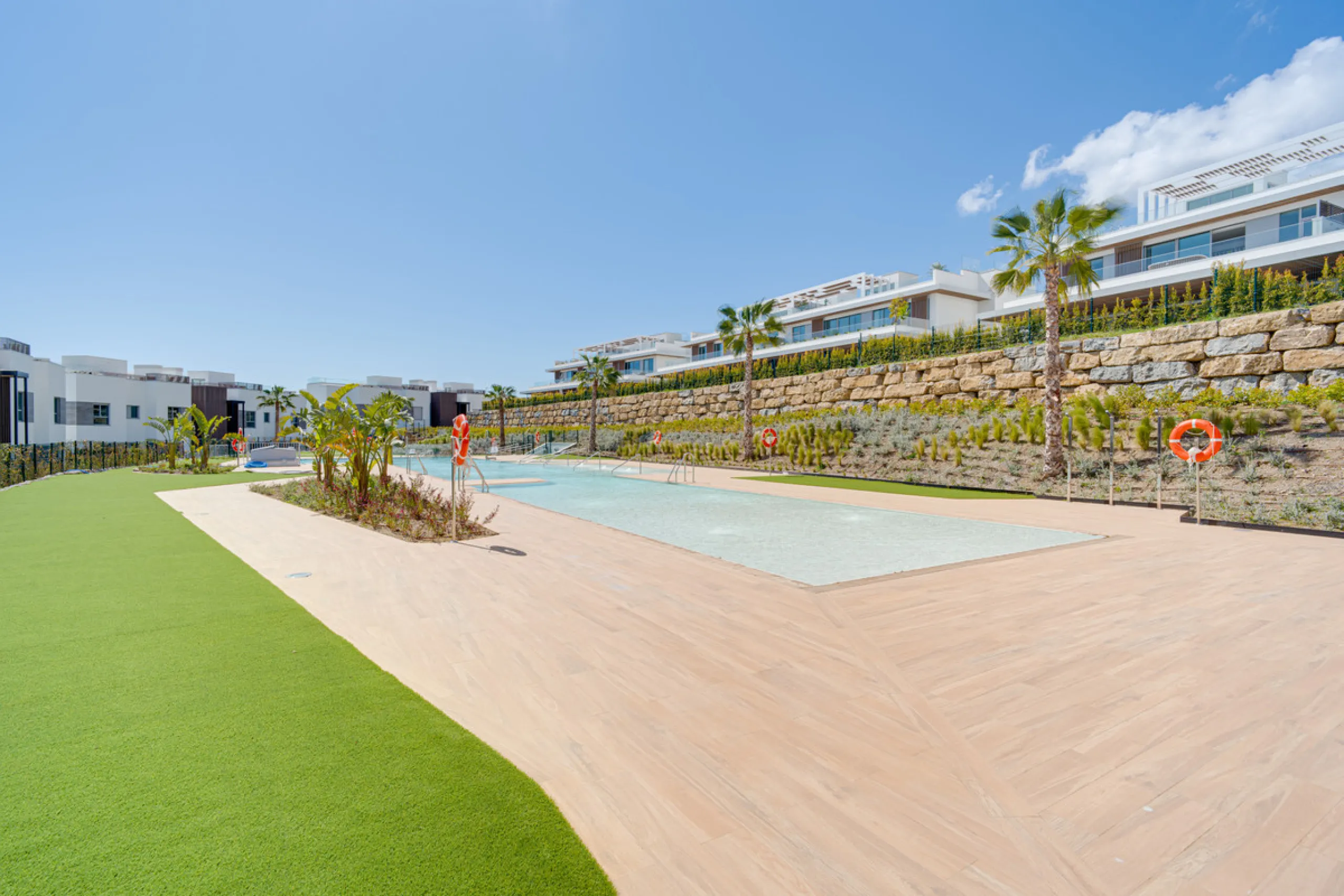 This magnificent ground-floor duplex apartment is located in Santa Clara, Marbella East, perfectly positioned close to the hospital, shops, golf courses, schools, and the beach. The property seamlessly blends indoor and outdoor living, featuring a private