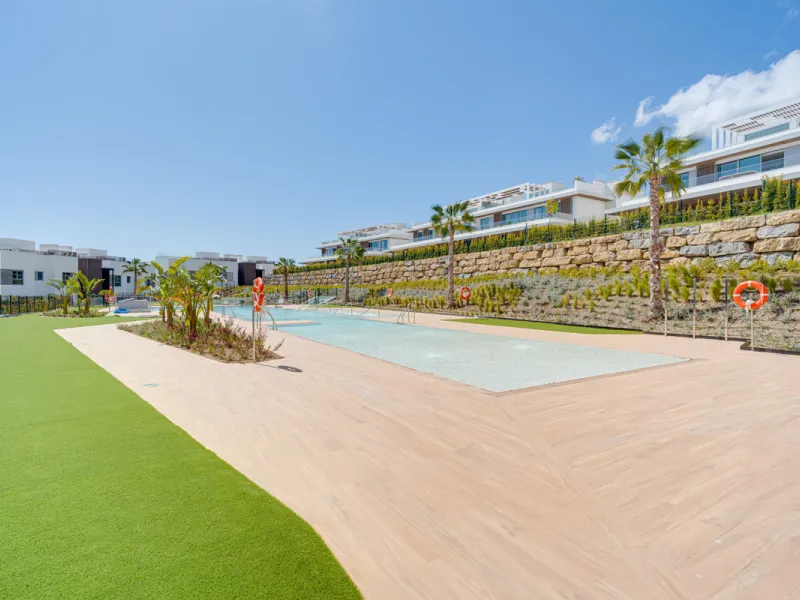 This magnificent ground-floor duplex apartment is located in Santa Clara, Marbella East, perfectly positioned close to the hospital, shops, golf courses, schools, and the beach. The property seamlessly blends indoor and outdoor living, featuring a private