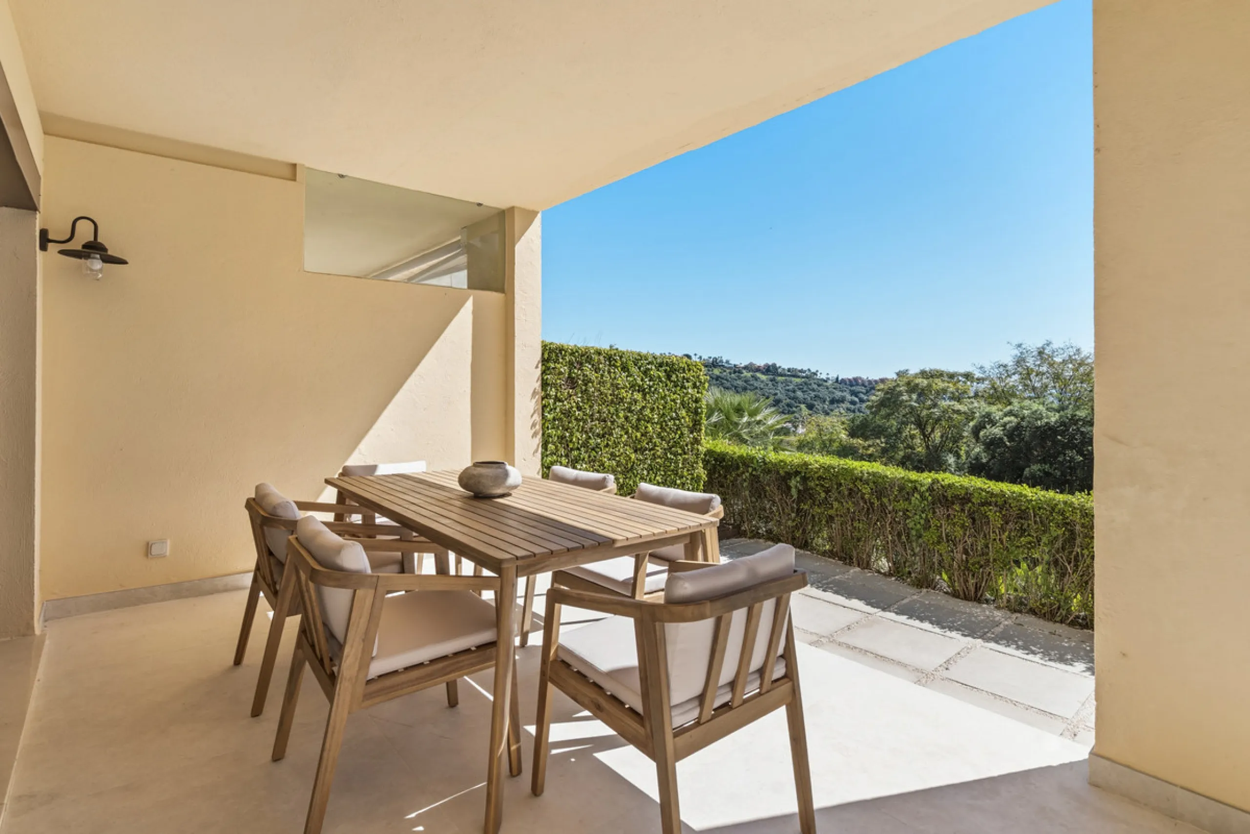 Discover this bright and elegant 3-bedroom, 2-bathroom ground floor apartment located in the sought-after Los Pinos community within Los Arqueros Golf & Country Club.