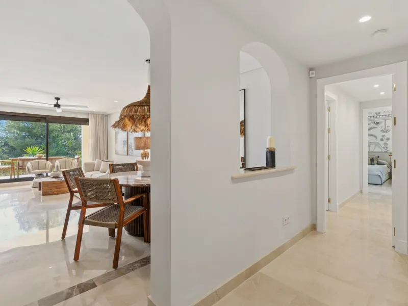 Discover this bright and elegant 3-bedroom, 2-bathroom ground floor apartment located in the sought-after Los Pinos community within Los Arqueros Golf & Country Club.