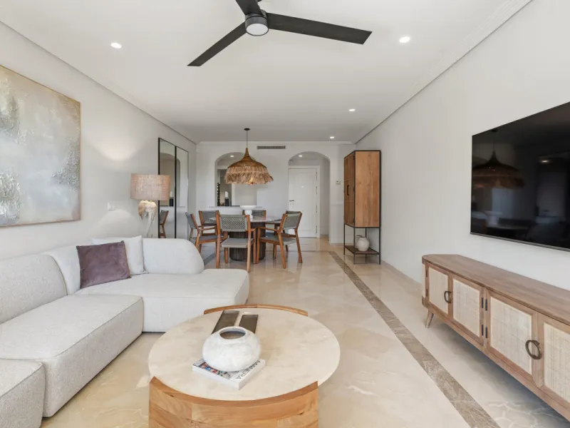 Discover this bright and elegant 3-bedroom, 2-bathroom ground floor apartment located in the sought-after Los Pinos community within Los Arqueros Golf & Country Club.