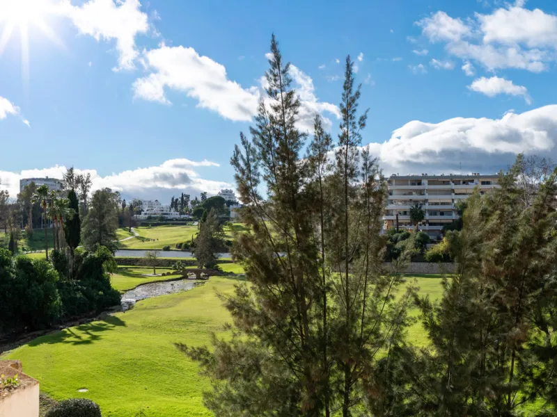 This beautifully refurbished yet thoughtfully personalised two-bedroom, two-bathroom apartment is set within the sought-after gated community of Campos de Guadalmina, offering open golf views from every bedroom.