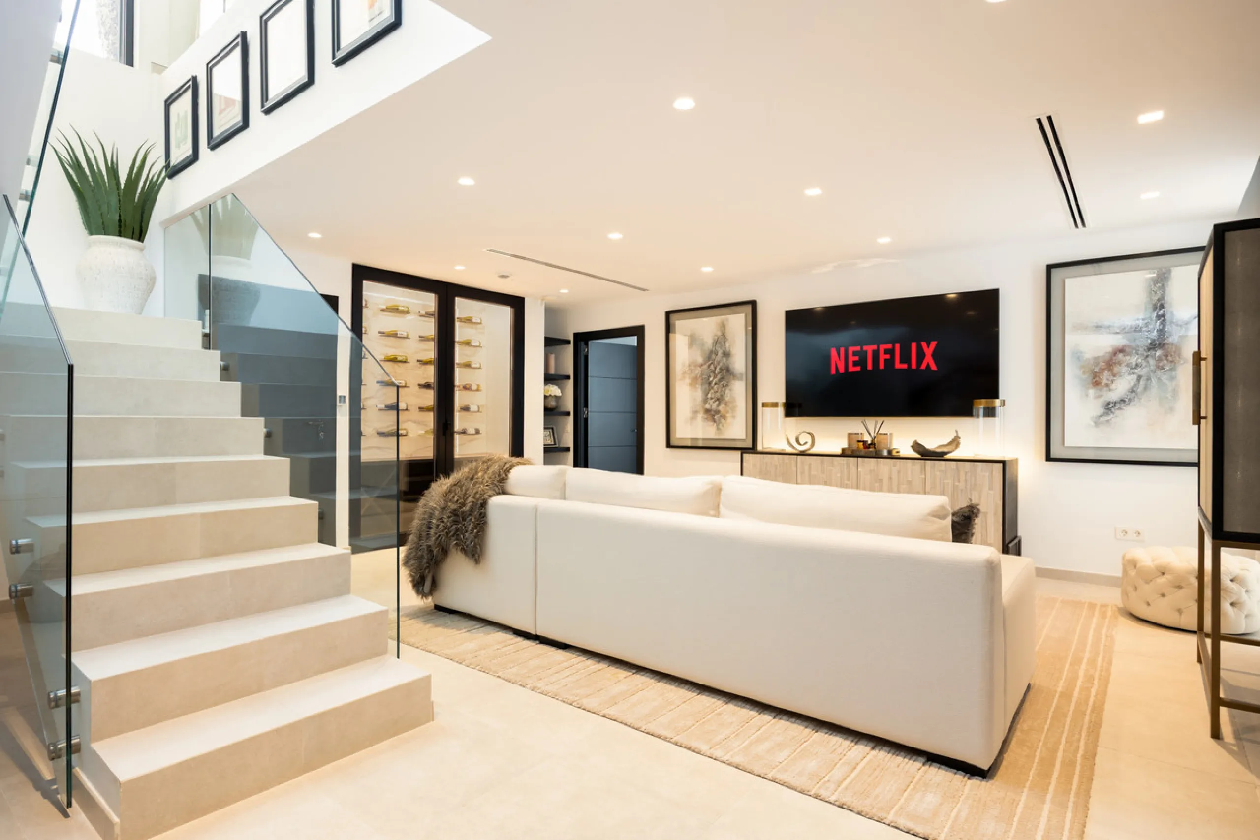 Contemporary villa set in the heart of Nueva Andalucía's prestigious Golf Valley, enjoying a privileged west-facing orientation overlooking the renowned Los Naranjos Golf Course. Distributed across three levels, the residence captures sweeping views of ma
