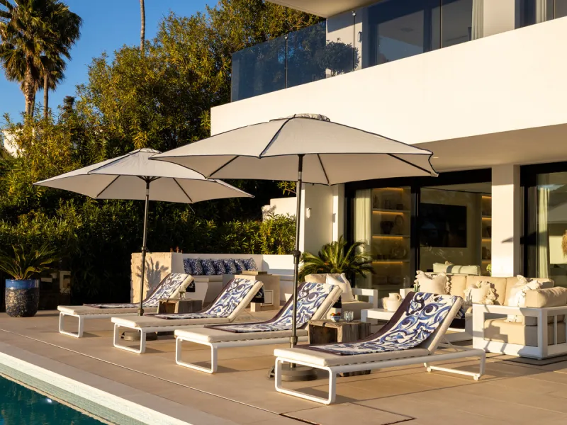 Contemporary villa set in the heart of Nueva Andalucía's prestigious Golf Valley, enjoying a privileged west-facing orientation overlooking the renowned Los Naranjos Golf Course. Distributed across three levels, the residence captures sweeping views of ma