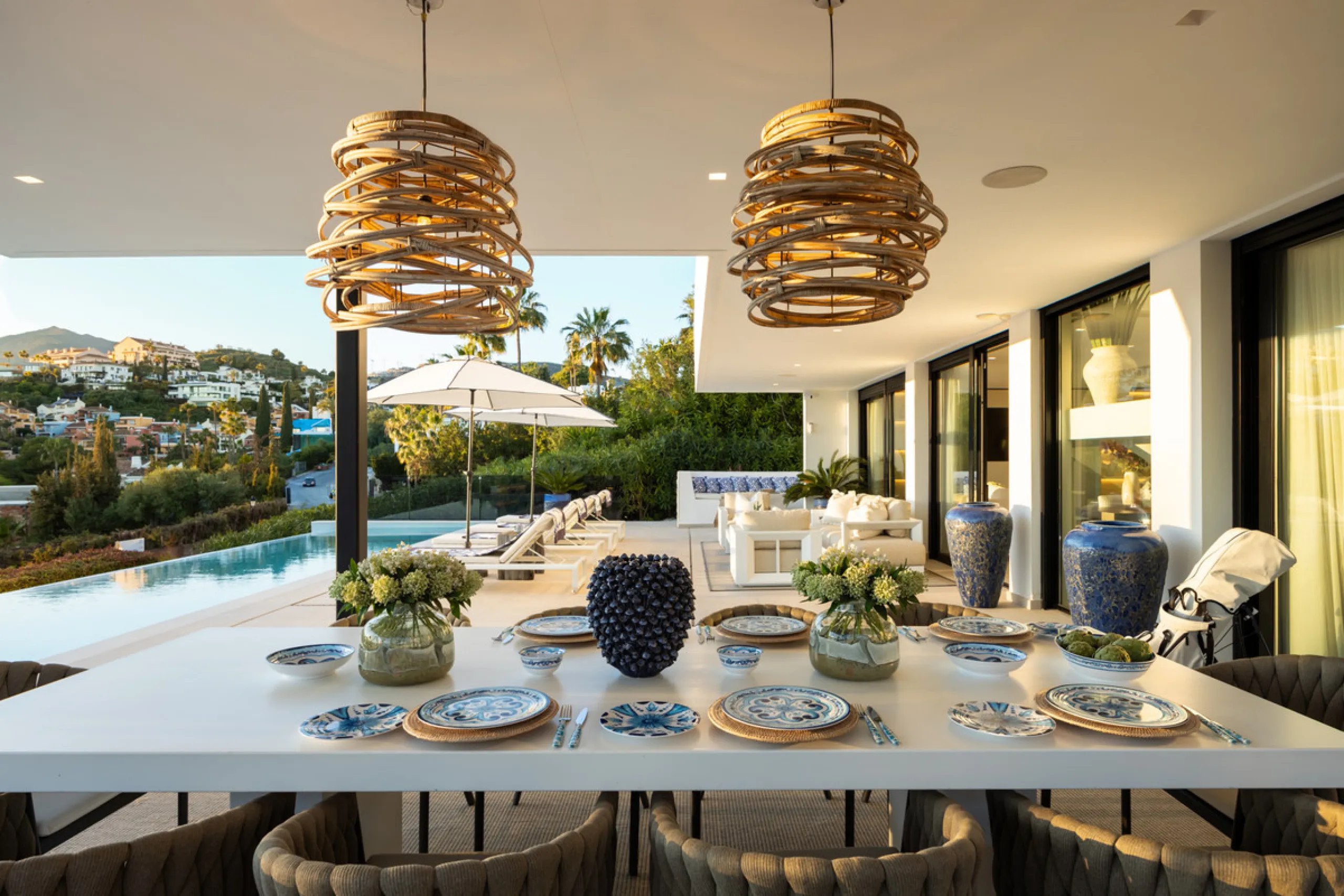 Contemporary villa set in the heart of Nueva Andalucía's prestigious Golf Valley, enjoying a privileged west-facing orientation overlooking the renowned Los Naranjos Golf Course. Distributed across three levels, the residence captures sweeping views of ma