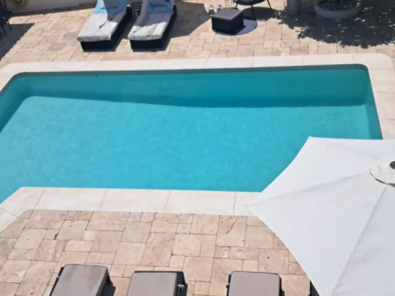 Stunning 6-bedroom, 6-bathroom detached villa located in a secure, gated community just a 10-minute walk from the beach and moments from the heart of Marbella.