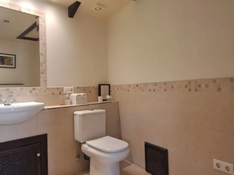 Stunning 6-bedroom, 6-bathroom detached villa located in a secure, gated community just a 10-minute walk from the beach and moments from the heart of Marbella.