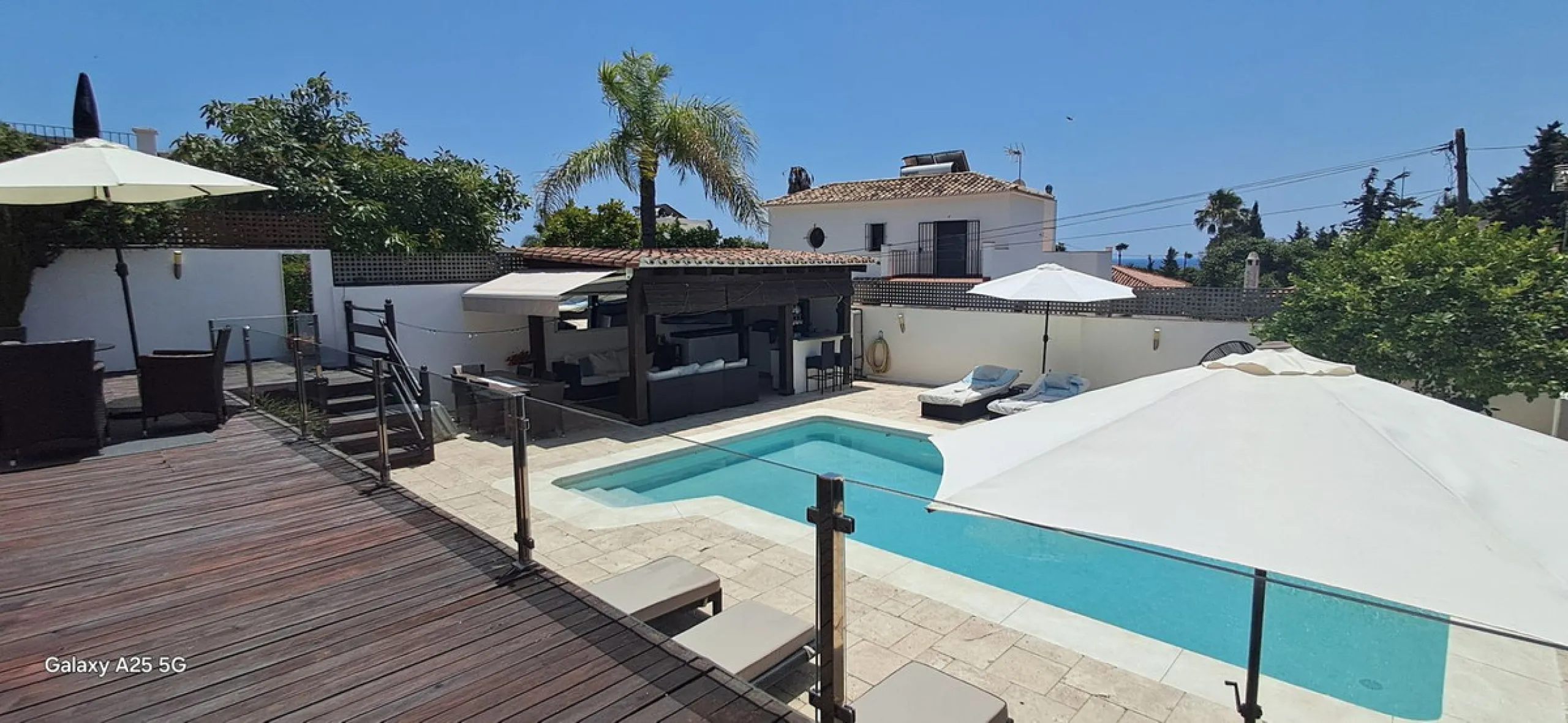 Stunning 6-bedroom, 6-bathroom detached villa located in a secure, gated community just a 10-minute walk from the beach and moments from the heart of Marbella.