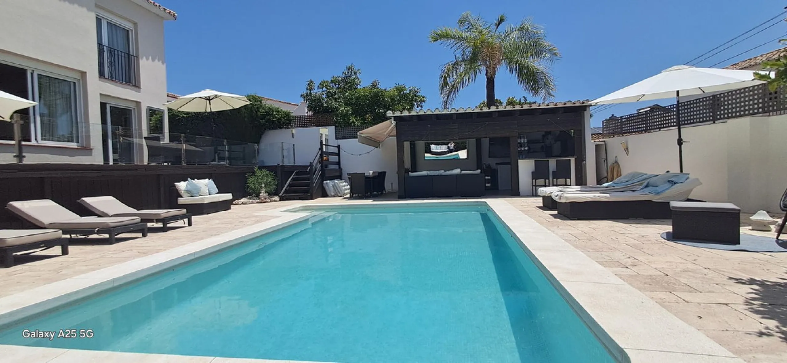 Stunning 6-bedroom, 6-bathroom detached villa located in a secure, gated community just a 10-minute walk from the beach and moments from the heart of Marbella.
