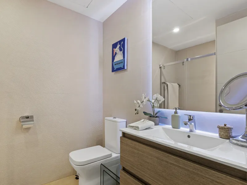 Set in an elevated position within the exclusive Finca Cortesin resort, this exceptional 2 bedroom, 2 bathroom ground-floor apartment epitomises contemporary luxury and refined Mediterranean living.