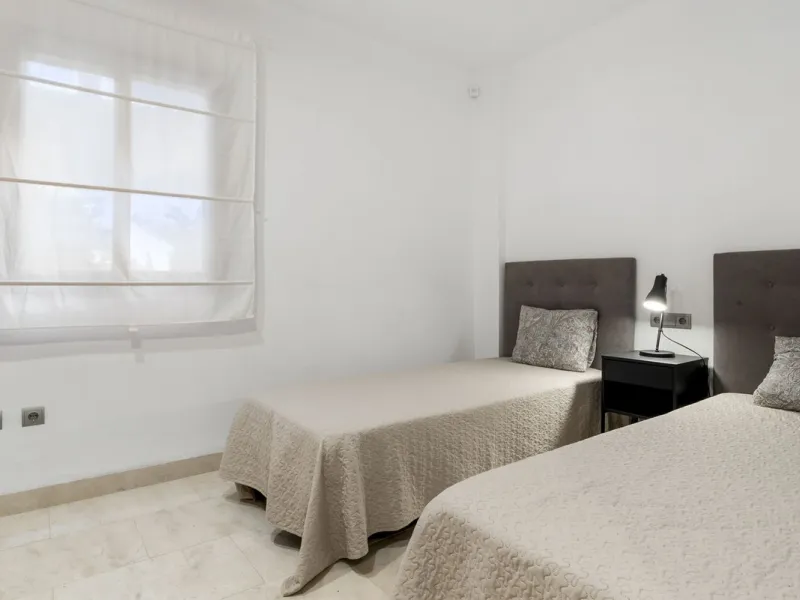 We are proud to present this luxurious ground-floor apartment, located within an exclusive gated and secure community renowned for its abundance of swimming pools and beautifully maintained green spaces.