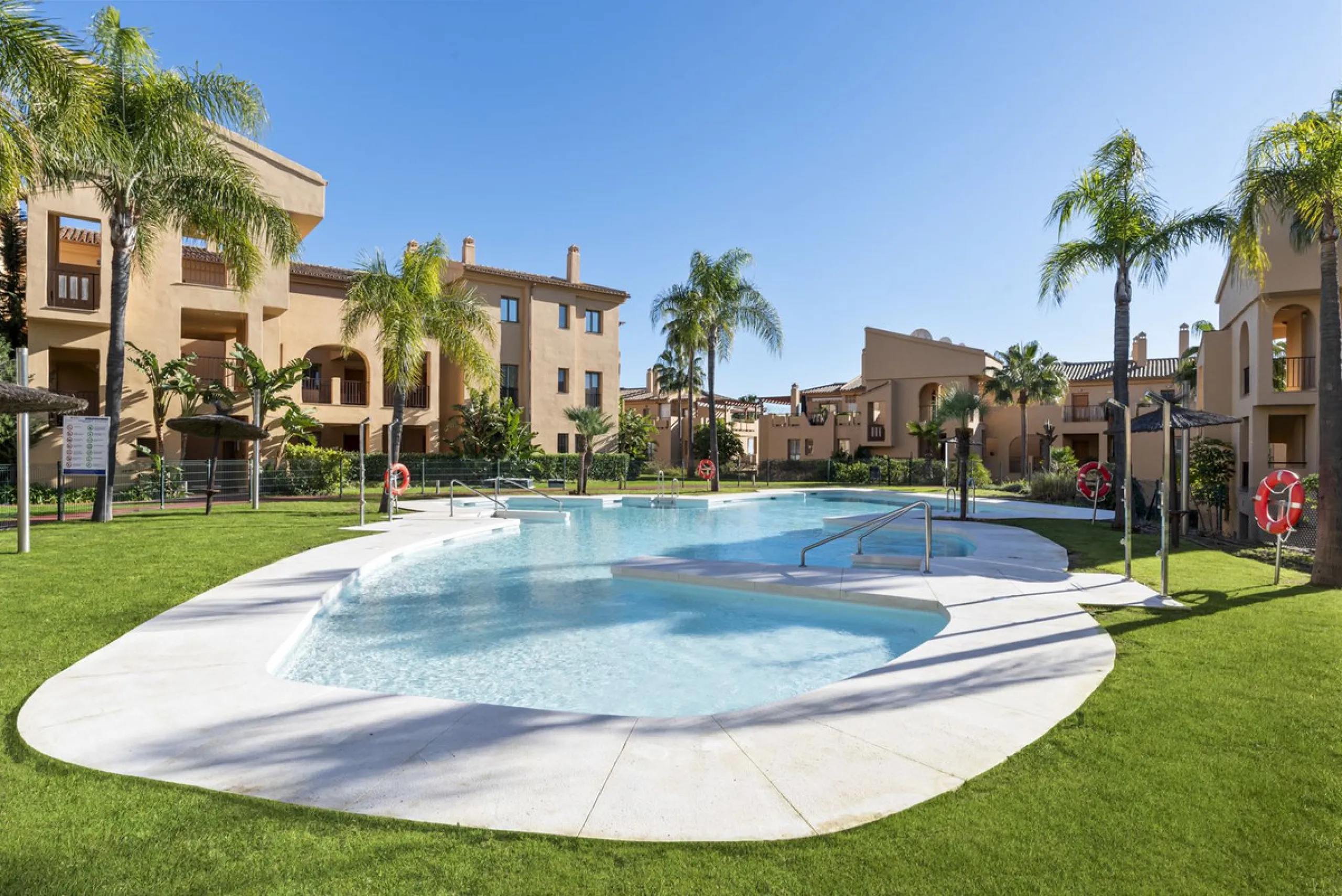 We are proud to present this luxurious ground-floor apartment, located within an exclusive gated and secure community renowned for its abundance of swimming pools and beautifully maintained green spaces.