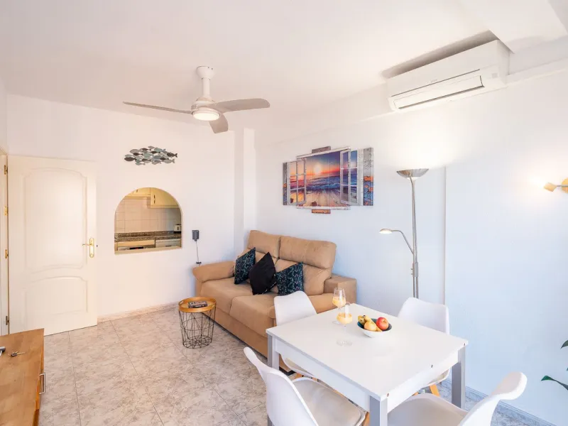 Discover this pristine, fully furnished 1-bedroom apartment in the iconic Edificio Perla 5, ideally positioned frontline beach in the very heart of Fuengirola, Málaga. Priced at €322,500, this residence offers spectacular beach and city views, combining M